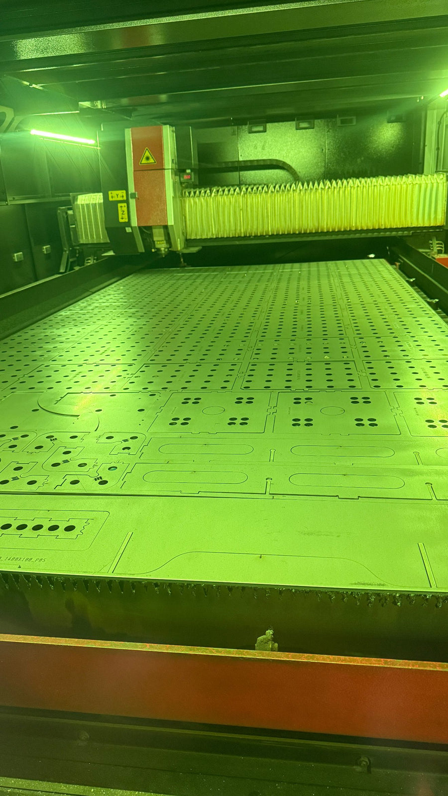 On the laser bed – Parts nested on the 6 kW Amada
